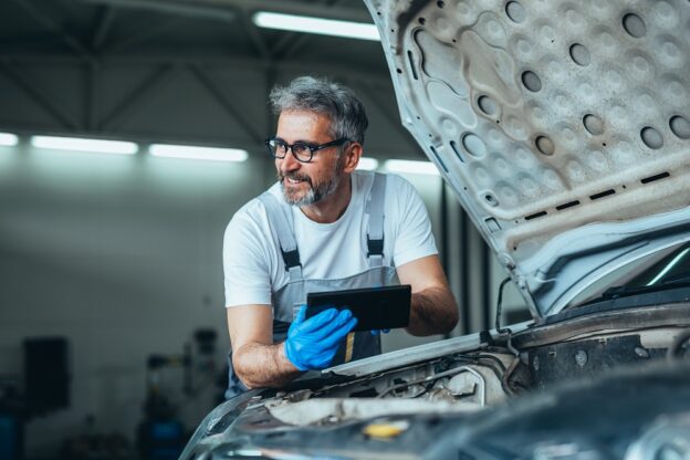 mechanic using tablet computer