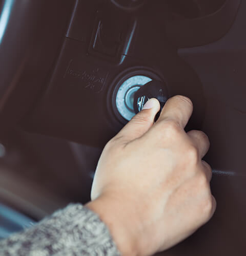 turning car keys to start a car